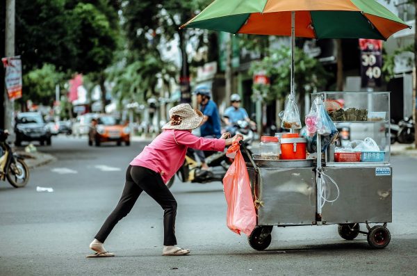 Street vendor pushing a cart